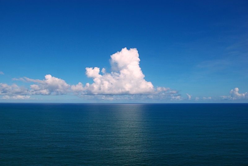 Image of sea with white cloud above