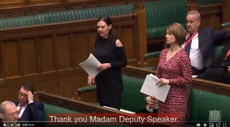 Vicky standing in the chamber asking a question. 