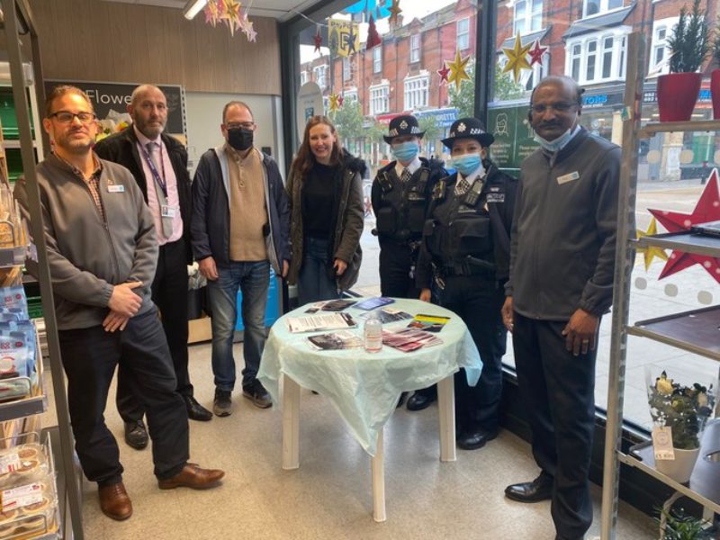 Photo of Vicky with staff from Brockley Co-op store and local police officers