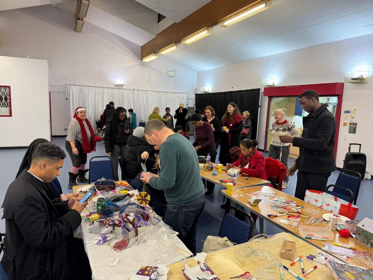 Councillors, Vicky, and Lewisham North residents doing crafts inside the Woodpecker Centre.
