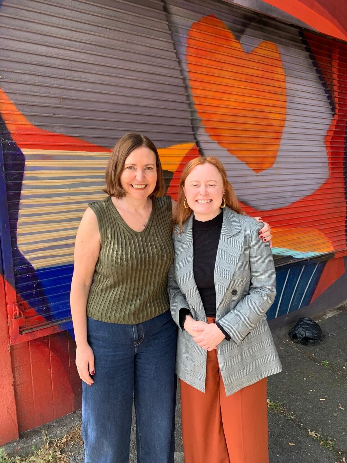 Vicky stood smiling next to UK Feminista Director, Nina. 