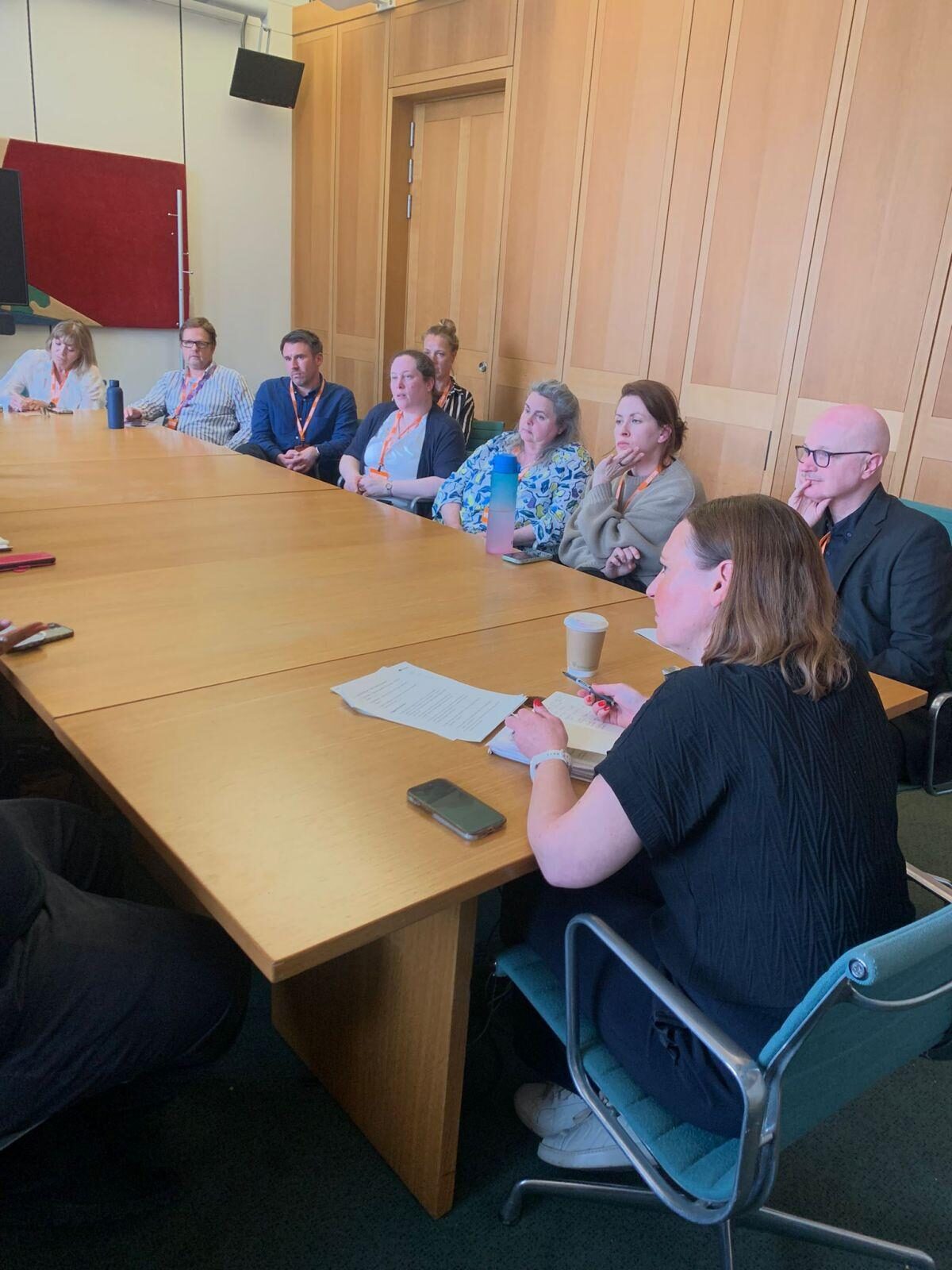 Vicky (right) sat listening to theatre professionals at the Theatre Roundtable.